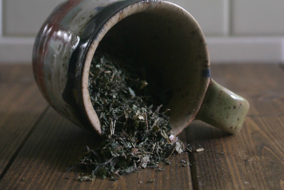 dried herbs spilling from mug