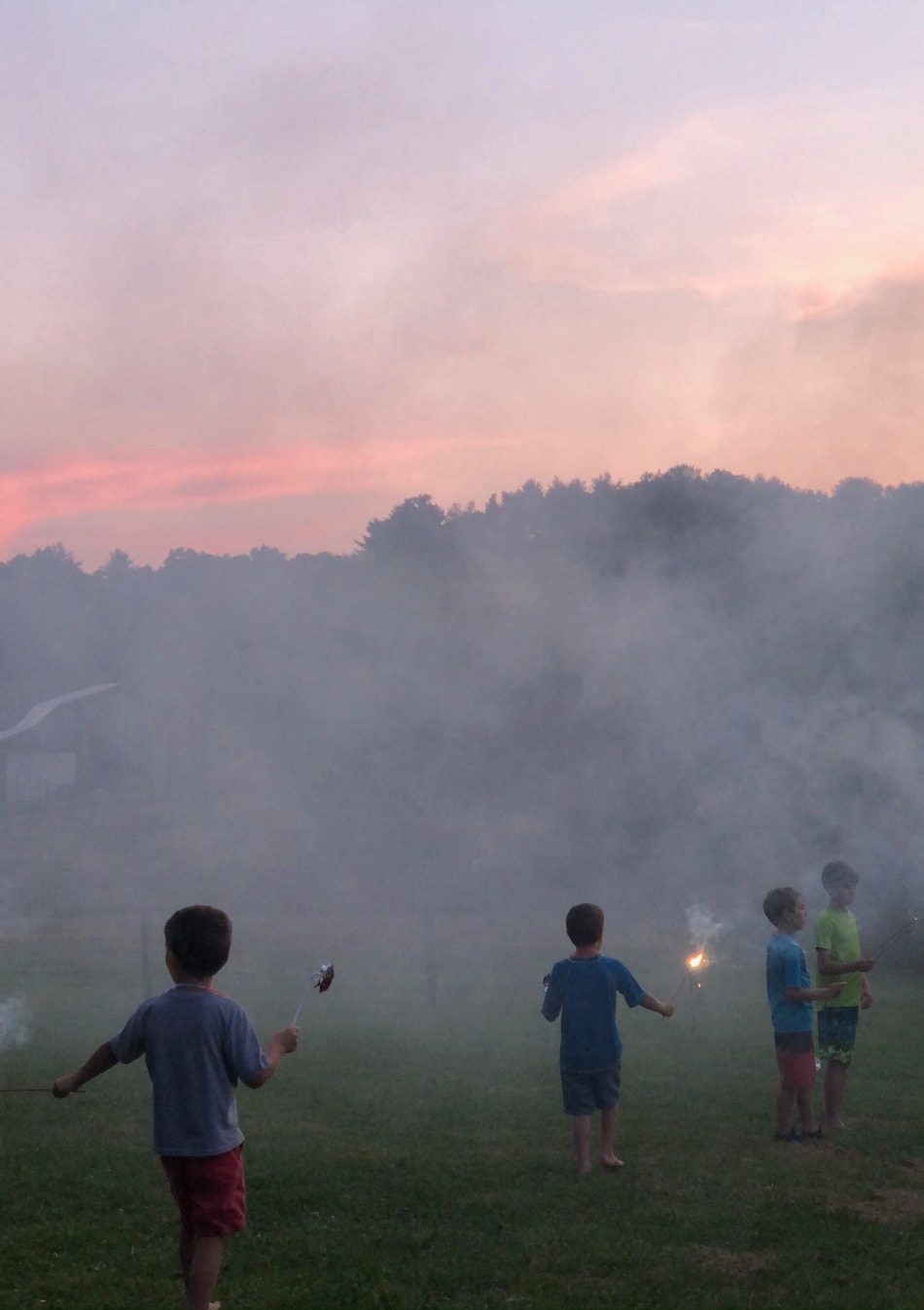 hazy field, sunset, and fireworks