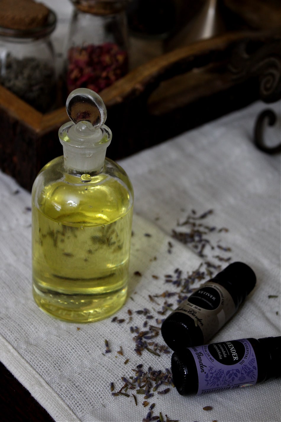 massage oil, essential oil bottles, lavender flowers
